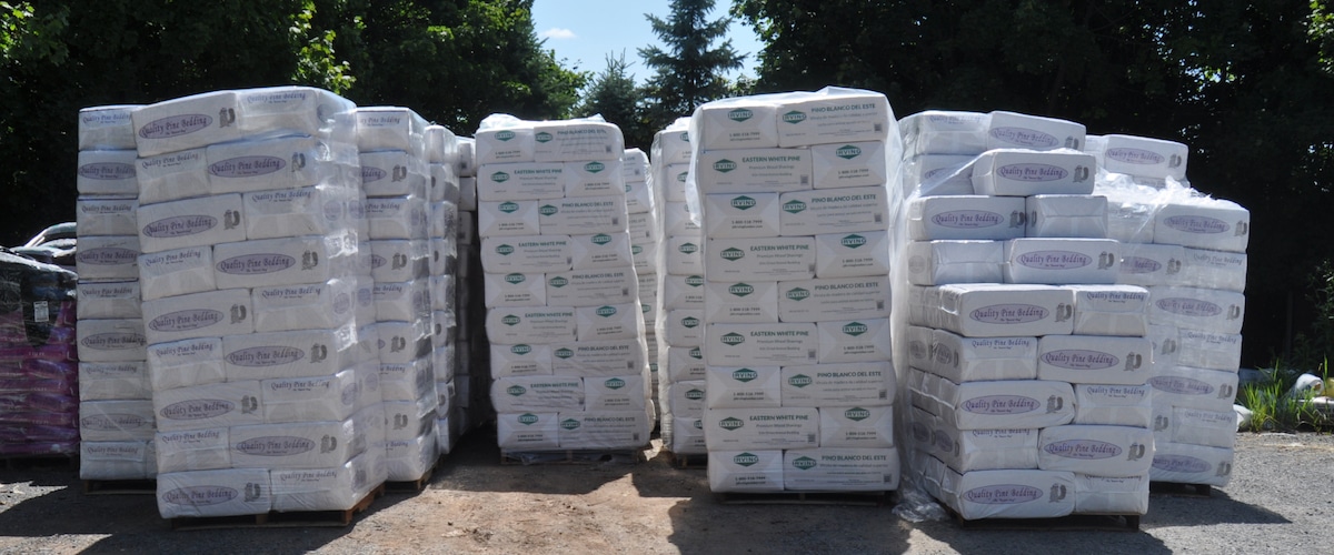 Packages of wood shavings for horse and livestock bedding